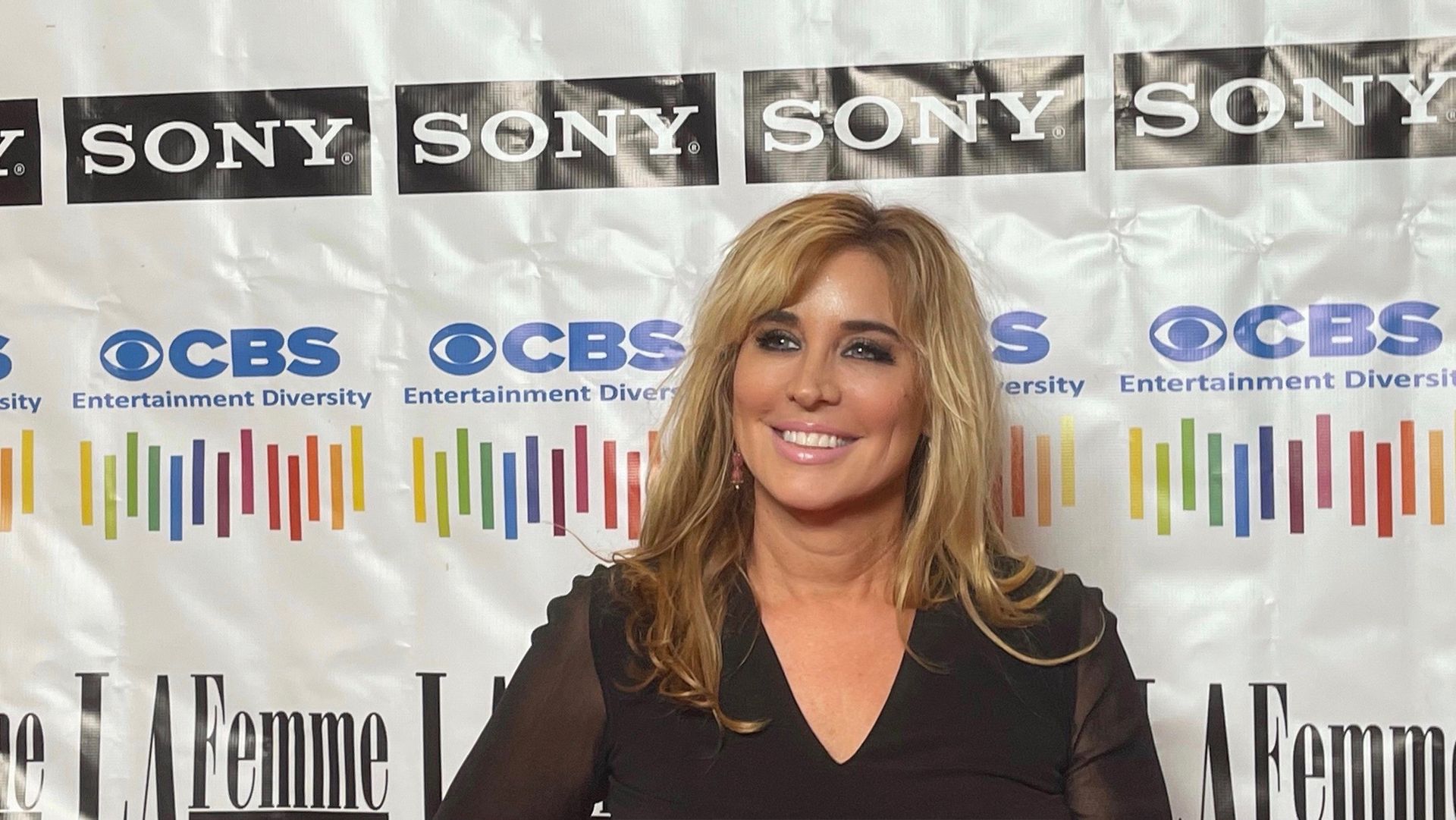 Barbara Ross  stands in front of a sony banner