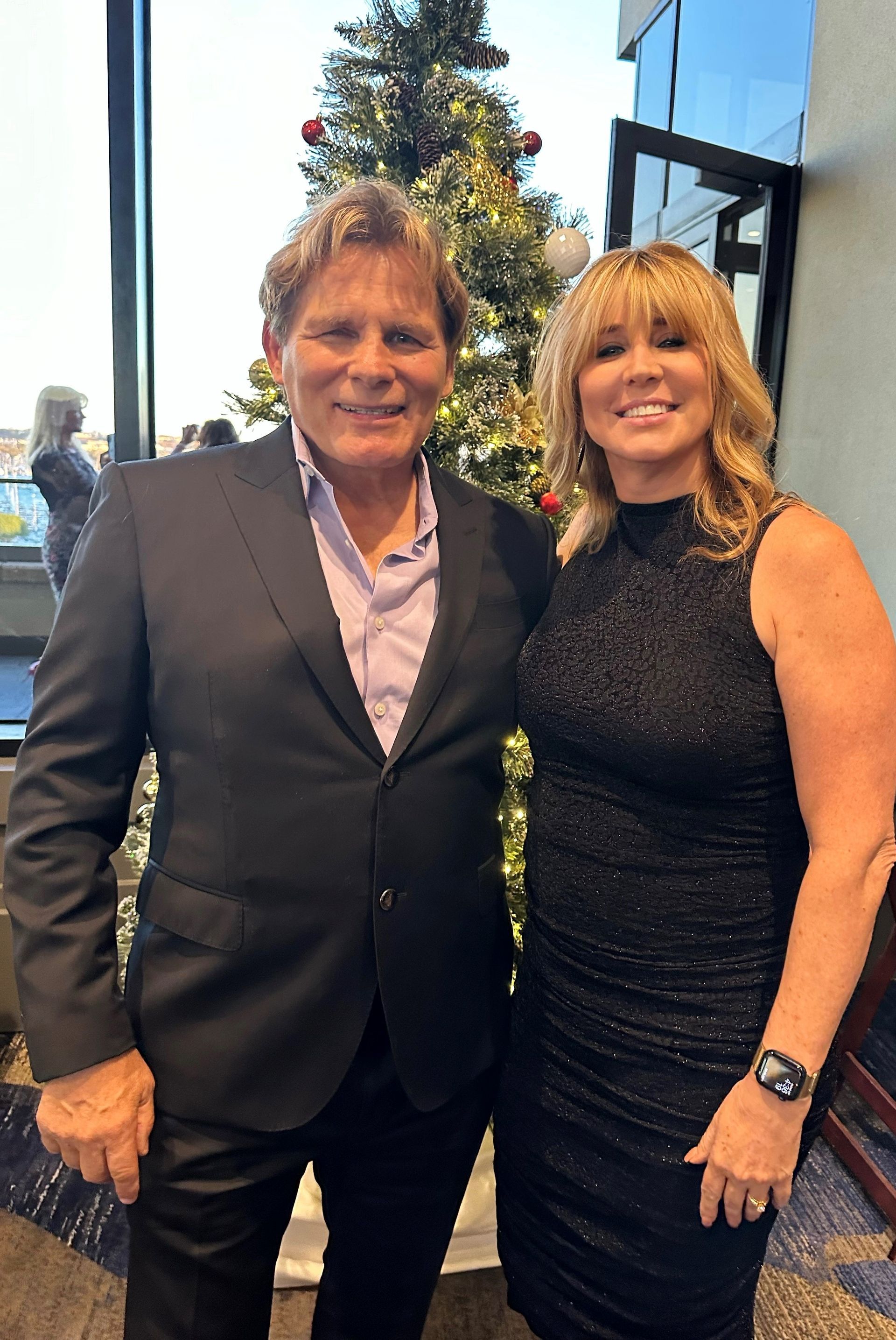 Mike and Barbara Ross pose for a picture attend the LA Rotary 5 Christmas party.