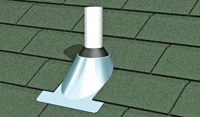 A pipe is sitting on top of a green roof.