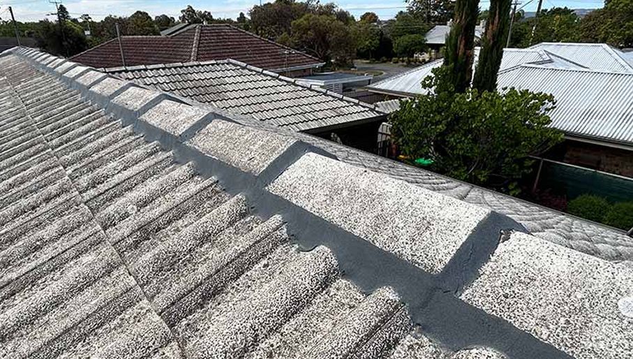 The roof of a house has a lot of shingles on it.