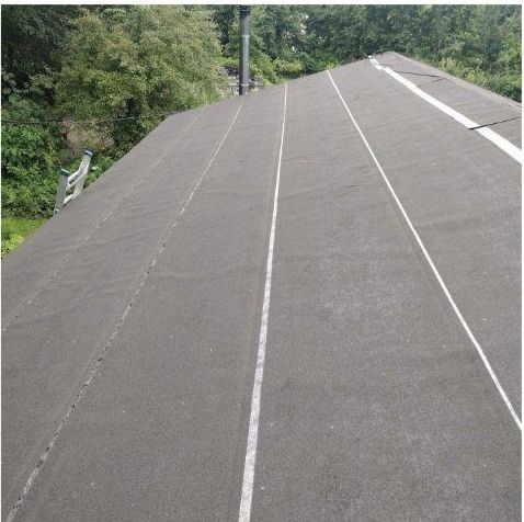 A black roof with a white line on it