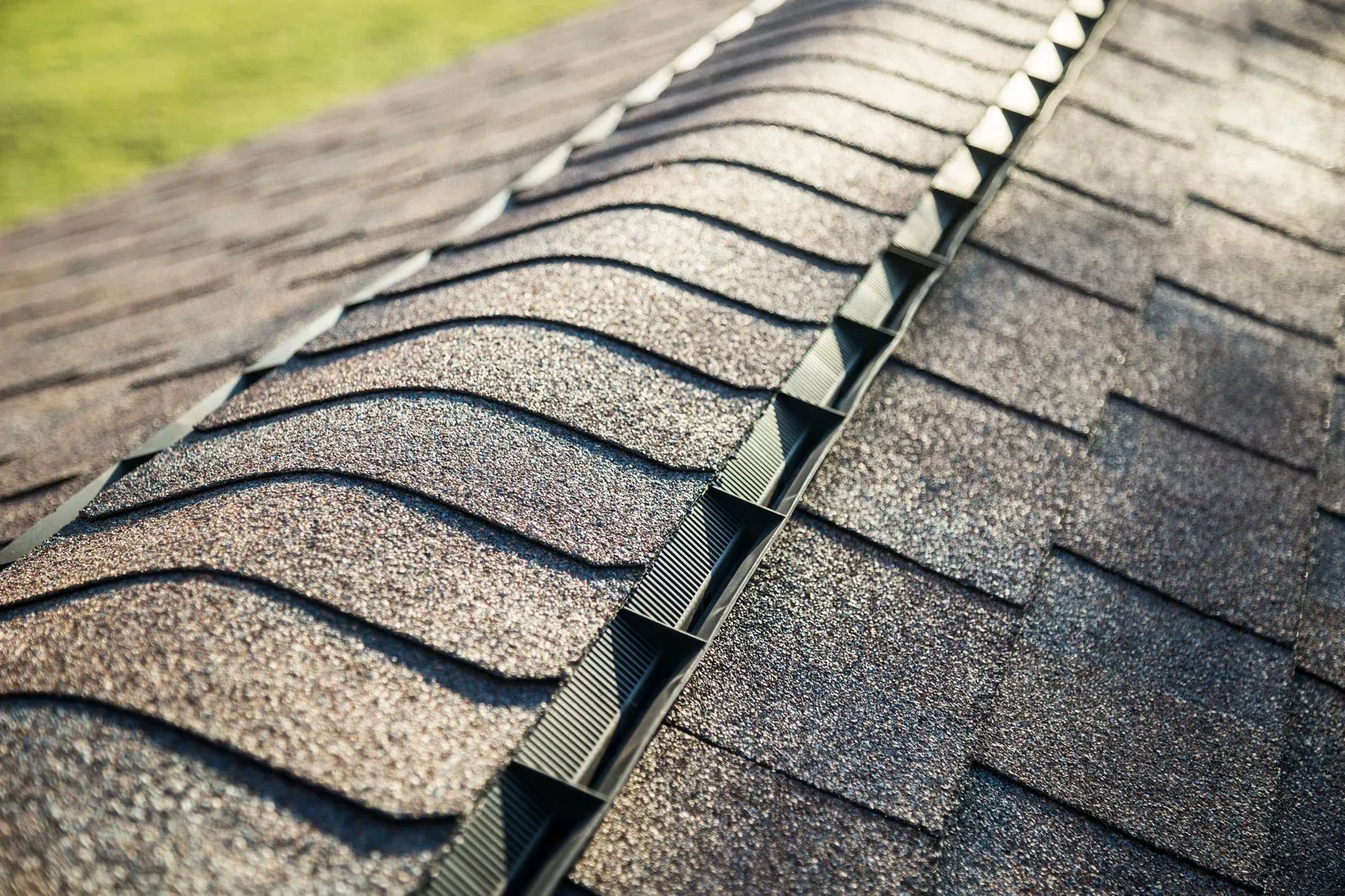 A close up of a roof with shingles on it.