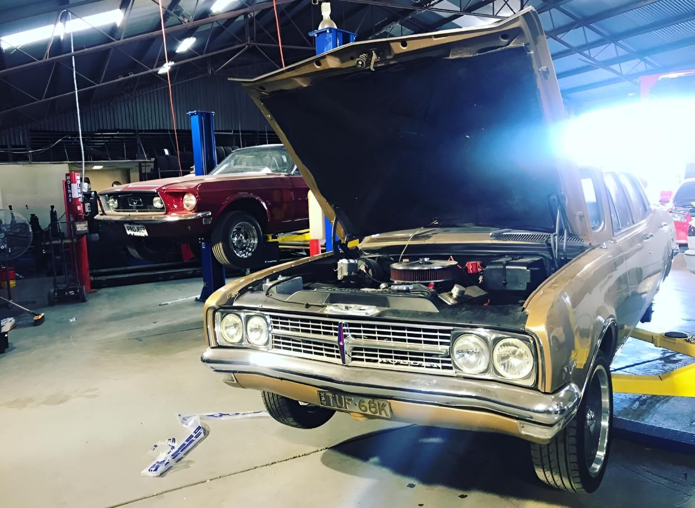A Car With The Hood Open Is Parked In A Garage — Territory Wrecking Repairs In Alice Springs, NT