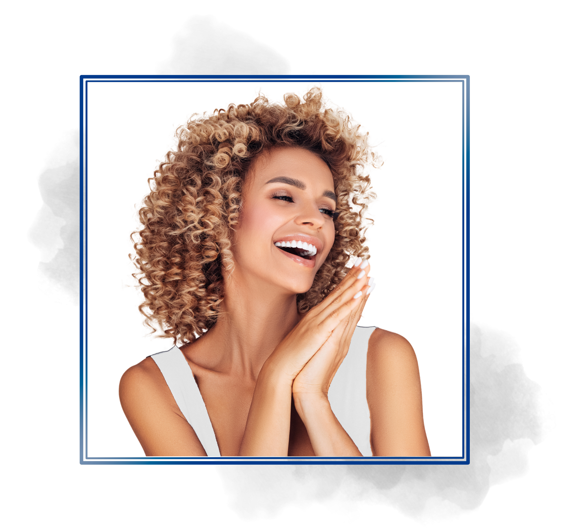 A woman with curly hair is smiling and covering her face with her hands.