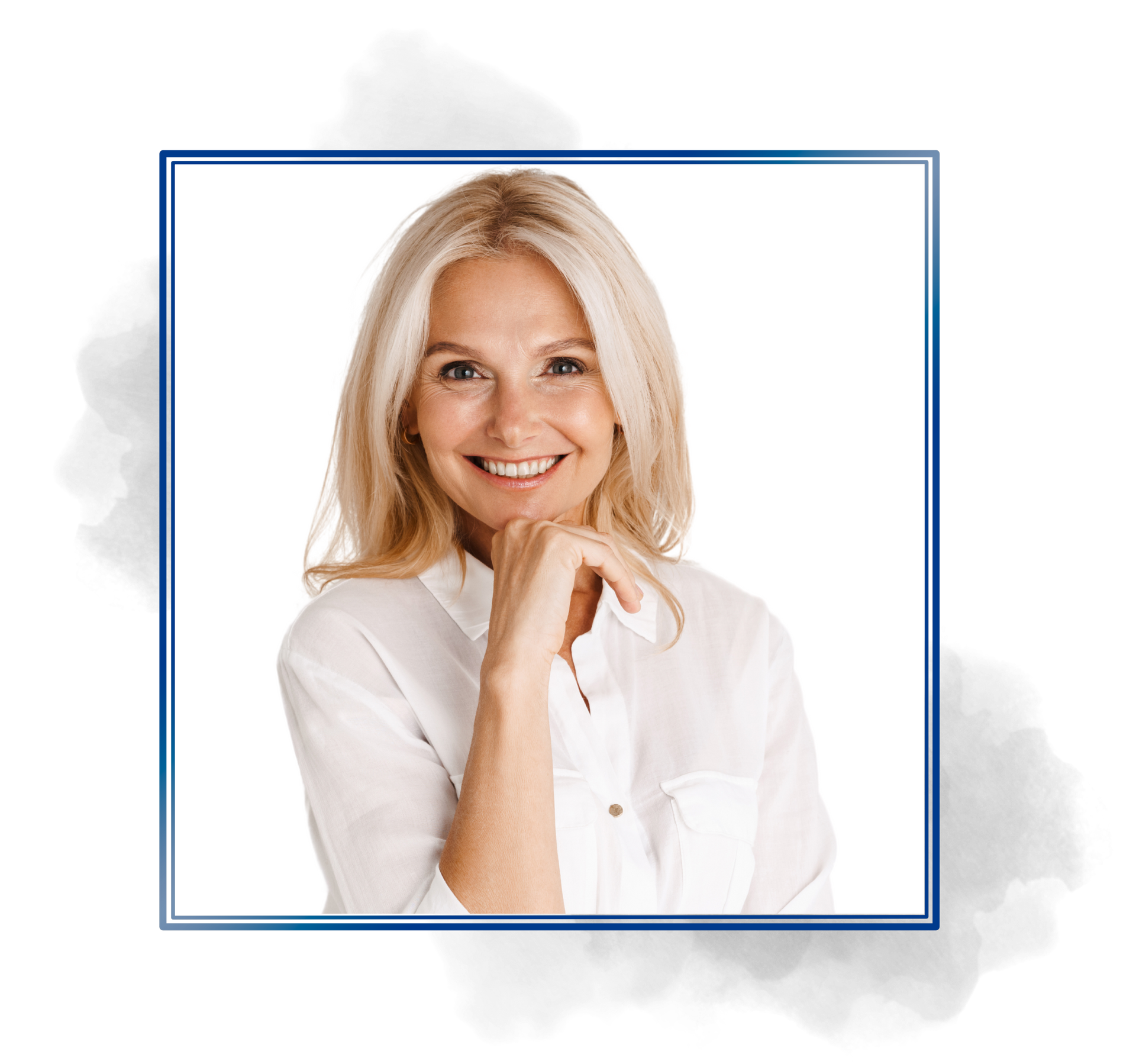 A woman in a white shirt is smiling with her hand on her chin.