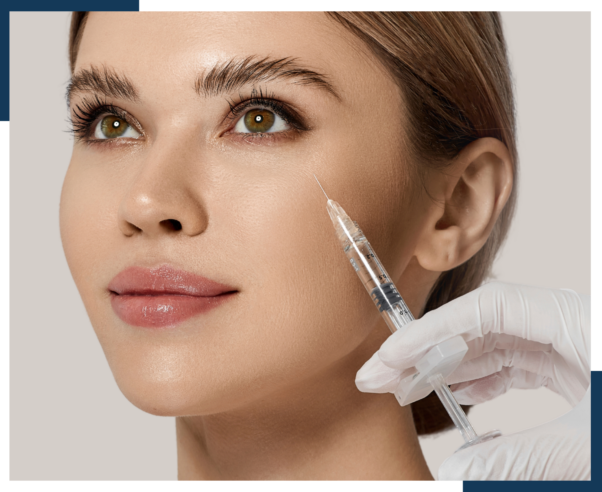 A woman is getting a botox injection in her face.