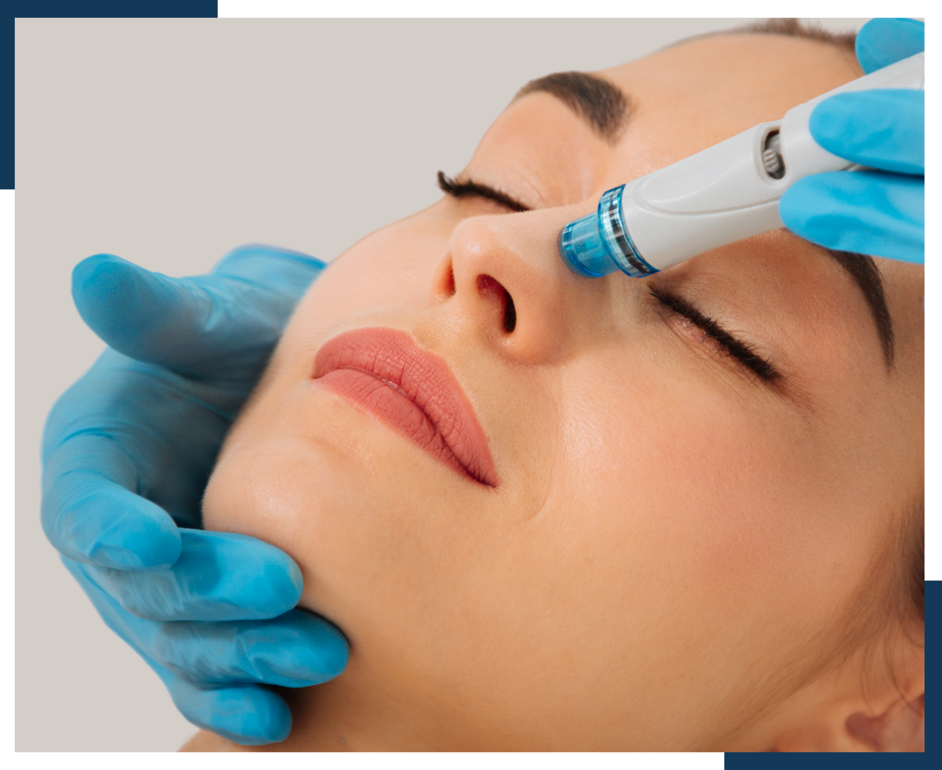 A woman is getting a facial treatment with a machine on her face.