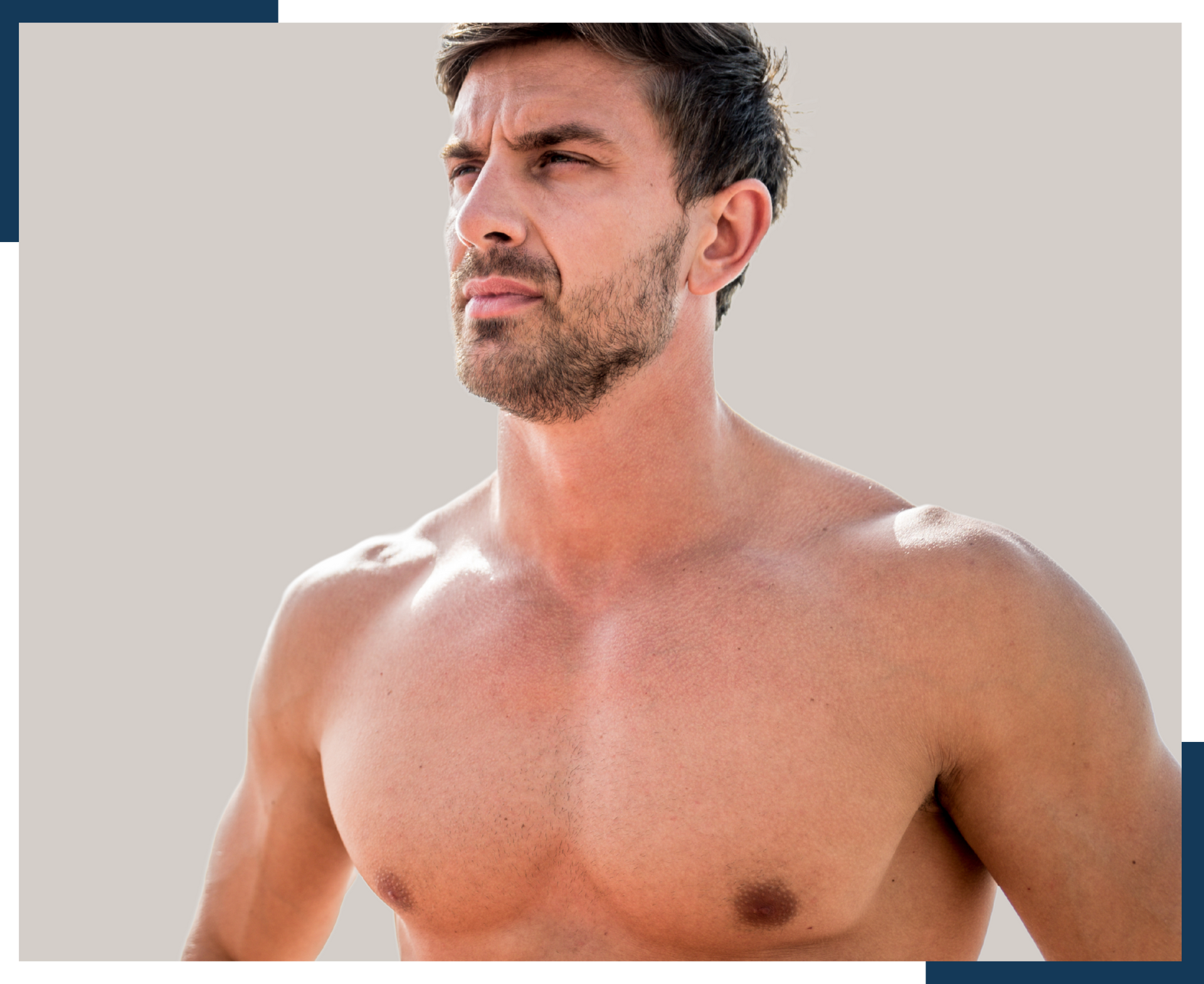 A shirtless man with a beard is standing on a beach.
