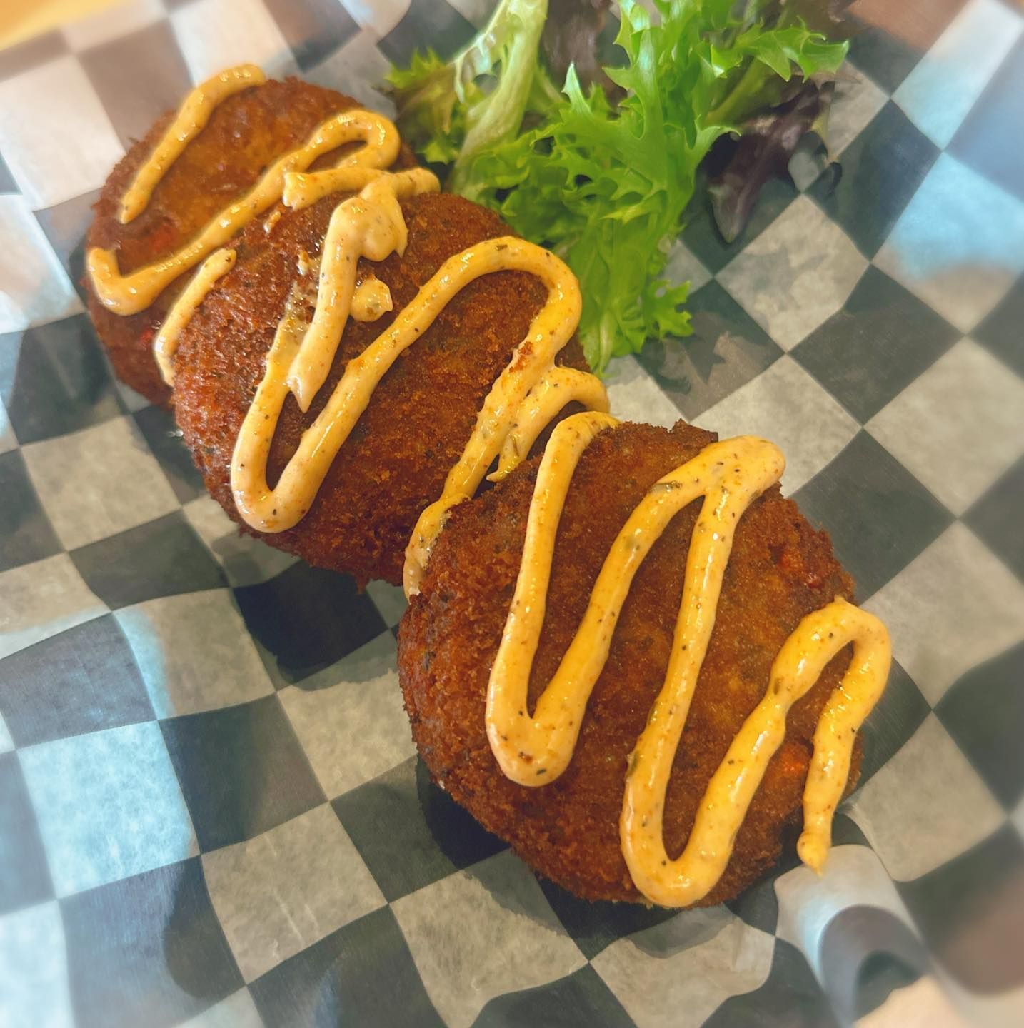 A close up of food on a checkered paper