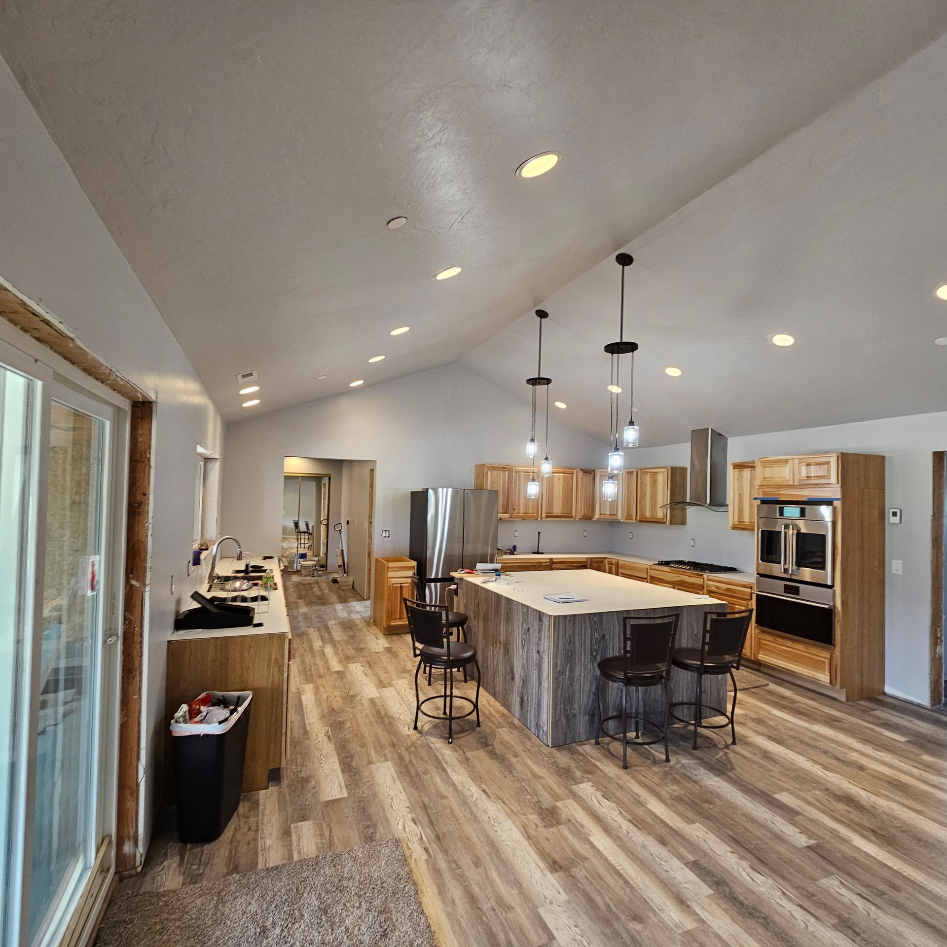 A bathroom with a vanity light hanging from the ceiling.