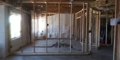 A room with a lot of wooden frames and a window.