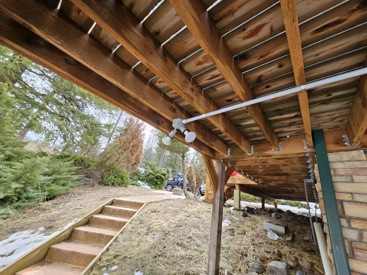 A wooden deck with stairs leading up to it