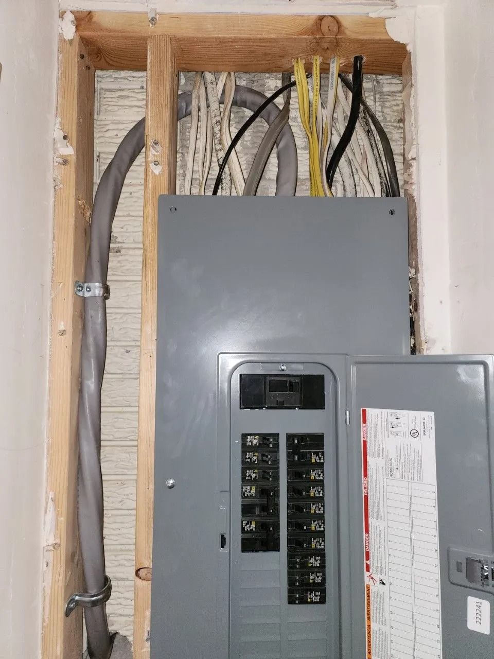 An electrical box with a lot of wires coming out of it