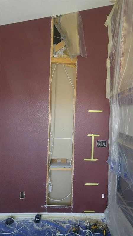 There is a hole in the wall in the middle of the room.