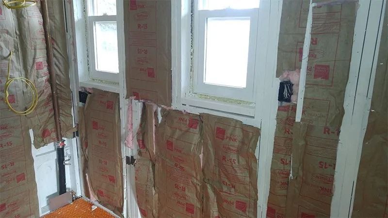 A room with a lot of insulation on the walls and windows.