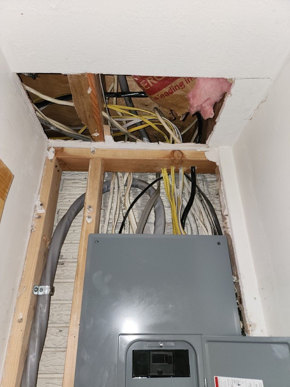 A electrical box with a lot of wires coming out of it
