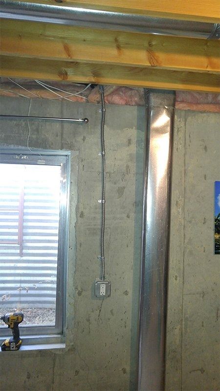 A room with a window and a drill in it.