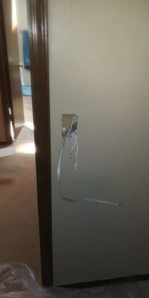 A close up of a door with a hole in it.