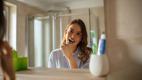 Woman Brushing Her Teeth — Sequim, WA — Sequim Advanced Dental, Dr. Brooksby