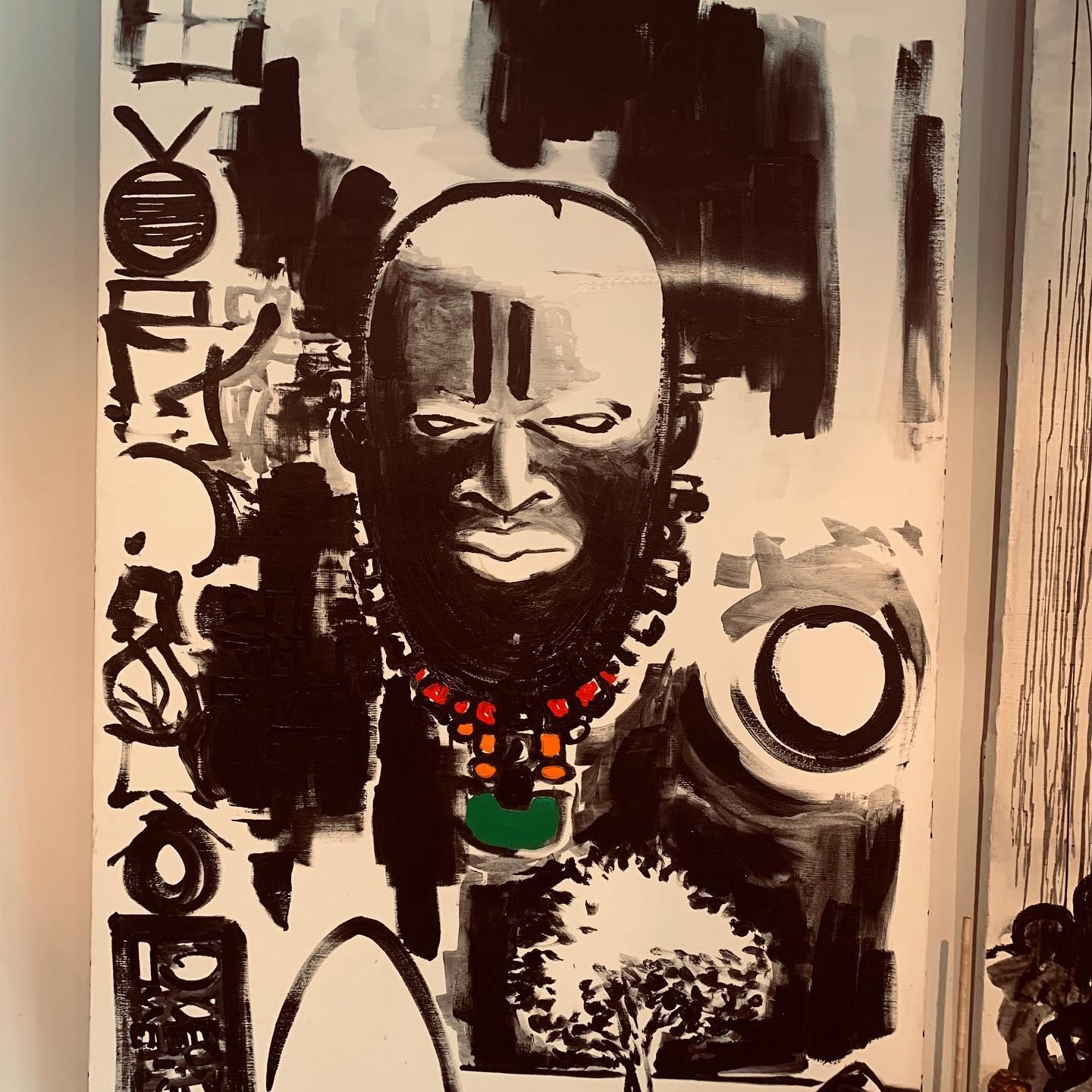 A black and white painting of a man with a necklace
