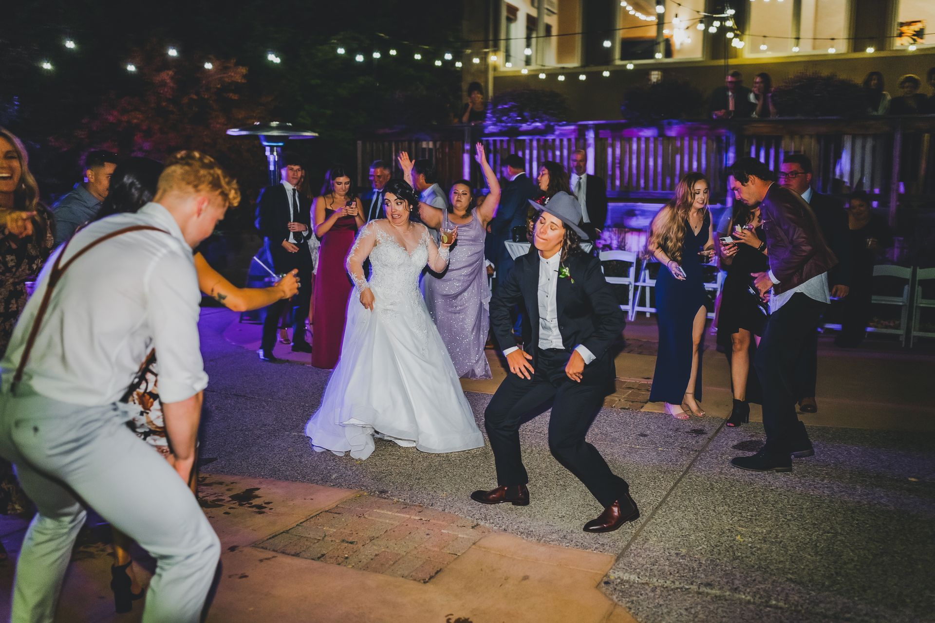 An LGBTQA+ couple dancing at their wedding