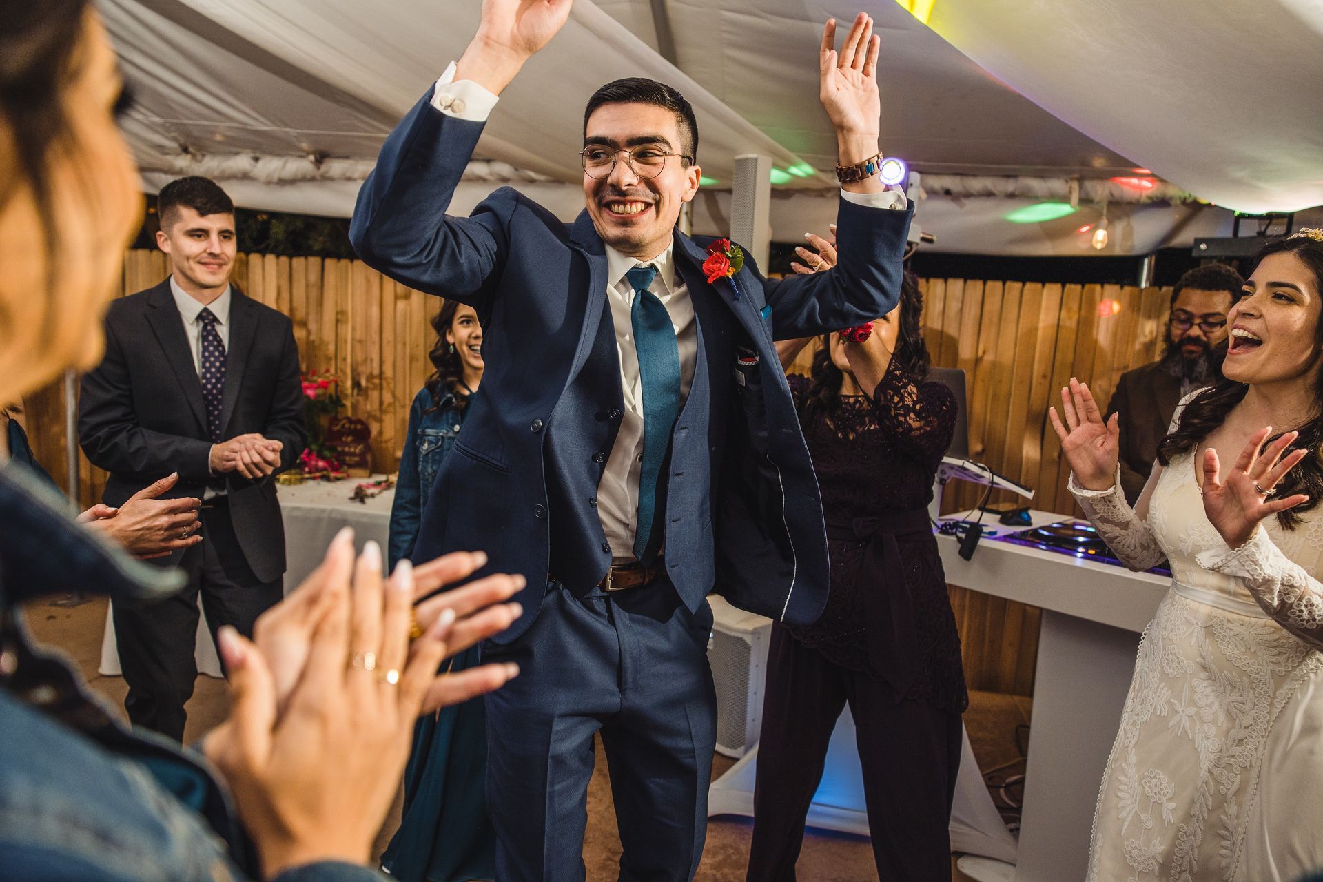 A wedding guests having a great time on the dance floor. 