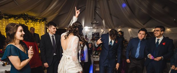 A bride and groom rocking out at their wedding