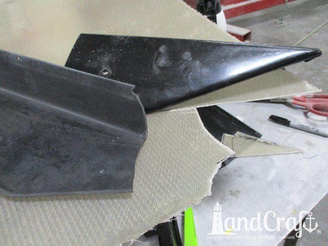 Wellcraft boat in process of exterior fiberglass and gelcoat repair