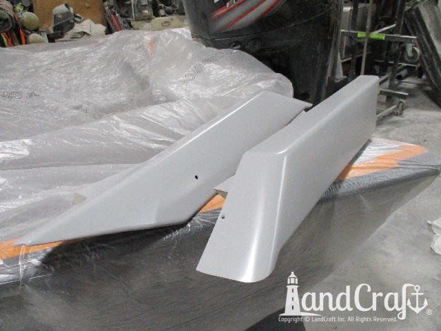 Wellcraft boat in process of exterior fiberglass and gelcoat repair