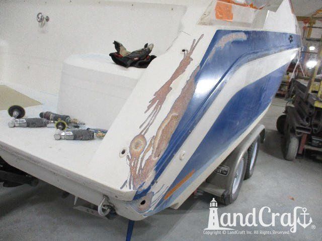 Wellcraft boat in process of exterior fiberglass and gelcoat repair
