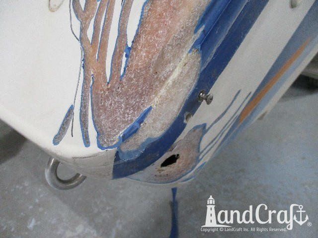 Wellcraft boat in process of exterior fiberglass and gelcoat repair