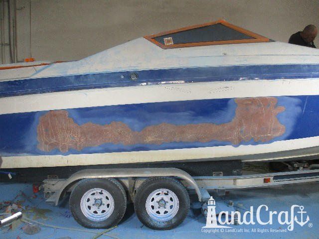 Wellcraft boat in process of exterior fiberglass and gelcoat repair