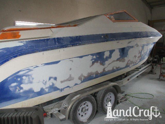 Wellcraft boat in process of exterior fiberglass and gelcoat repair