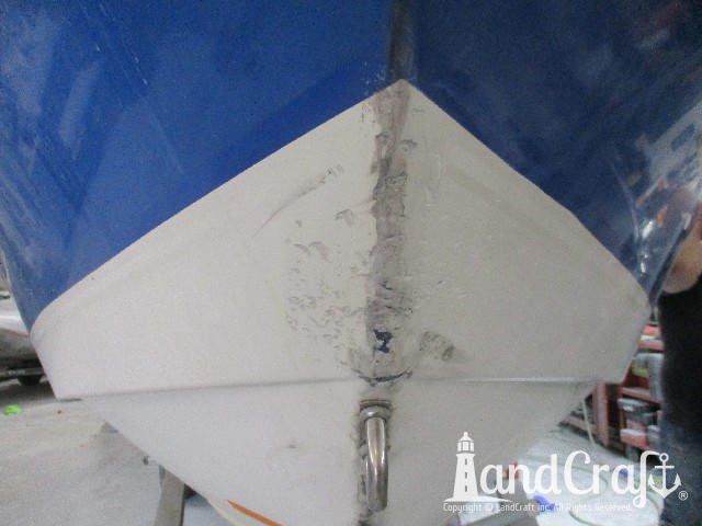 Wellcraft boat in process of exterior fiberglass and gelcoat repair