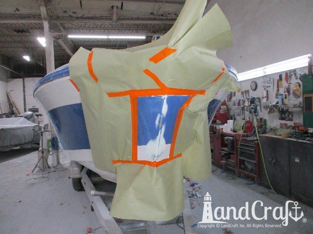 Wellcraft boat in process of exterior refinishing prep work