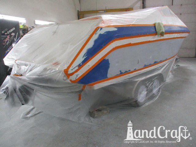 Wellcraft boat in process of exterior refinishing prep work