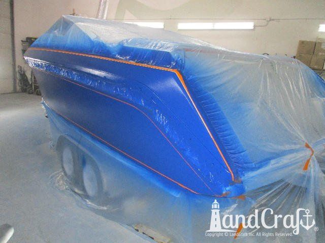 Wellcraft boat in process of exterior refinishing