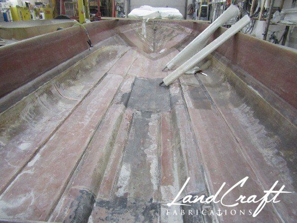 Spirit boat bottom hull interior in process of structural fiberglass repair