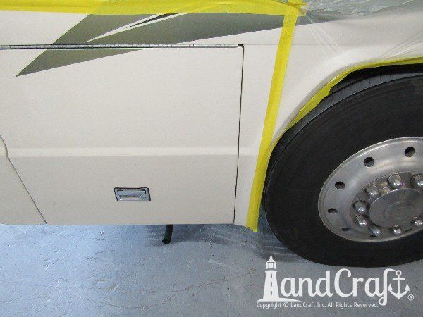 Country Coach motor coach with rear end damage in the repair process