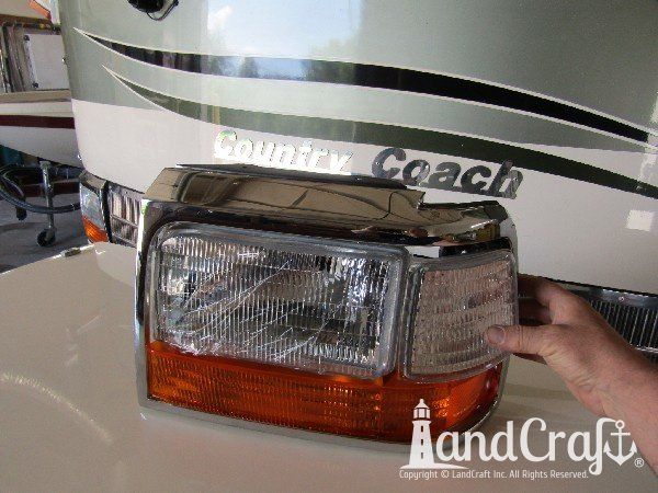 Country Coach motor coach with front end damage in the repair process