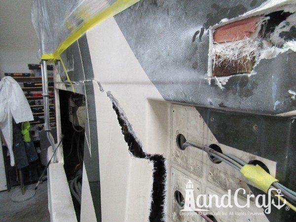 Country Coach motor coach with rear end damage in the repair process