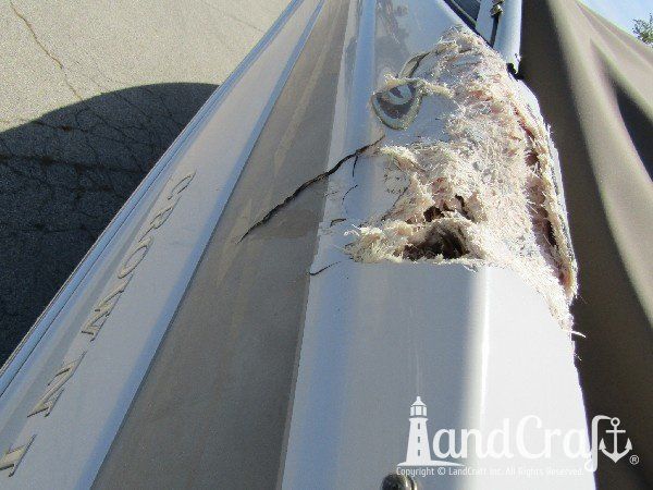Crownline boat with structural fiberglass collision damage along top gunnel