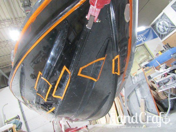 Picture of bottom scratch and dent damage on aluminum boat