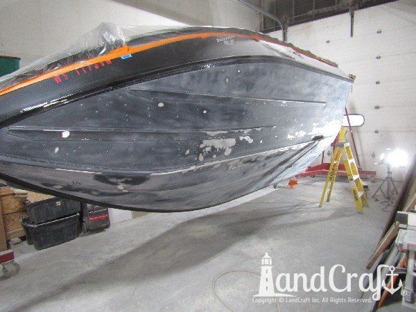 Picture of in process repair of bottom damage on aluminum boat