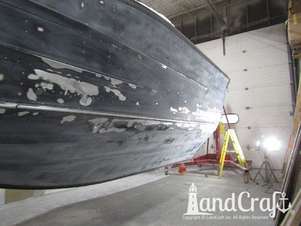 Picture of in process repair of bottom damage on aluminum boat