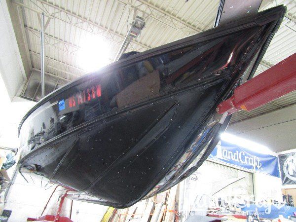 Picture of black finish on a freshly painted and repaired aluminum boat
