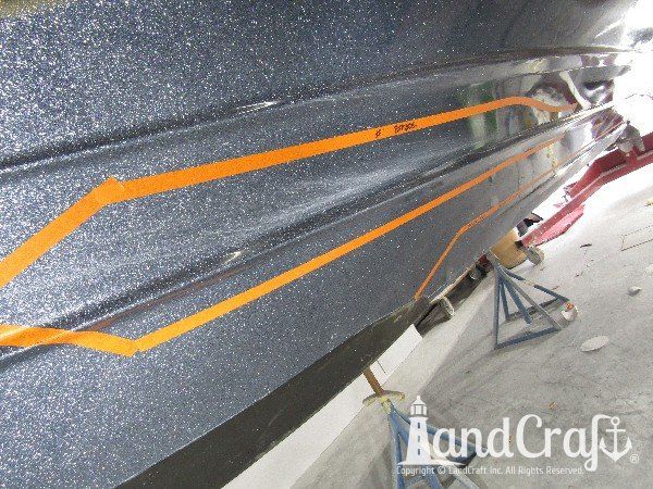 Legend boat with multiple areas of bottom damage