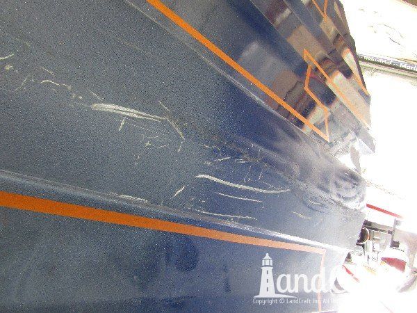 Legend boat with multiple areas of bottom damage