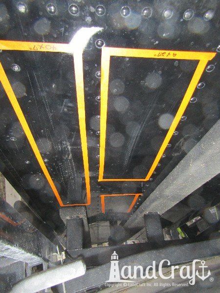 Damage along bottom of aluminum boat