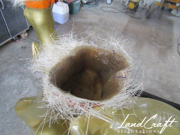 Top Cow art piece statue fiberglass structural repairs in process